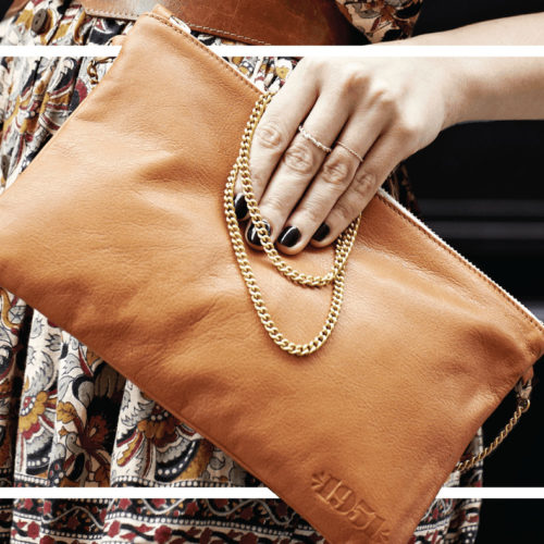 Woman Holding 1951 Maison Française Tan Leather Handbag