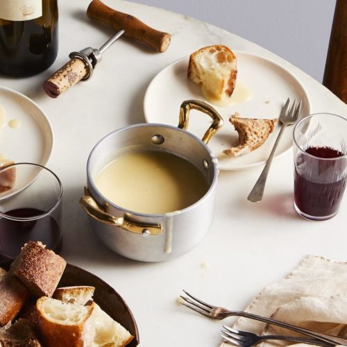 Fondue Fribourgeouis with Bread on a table